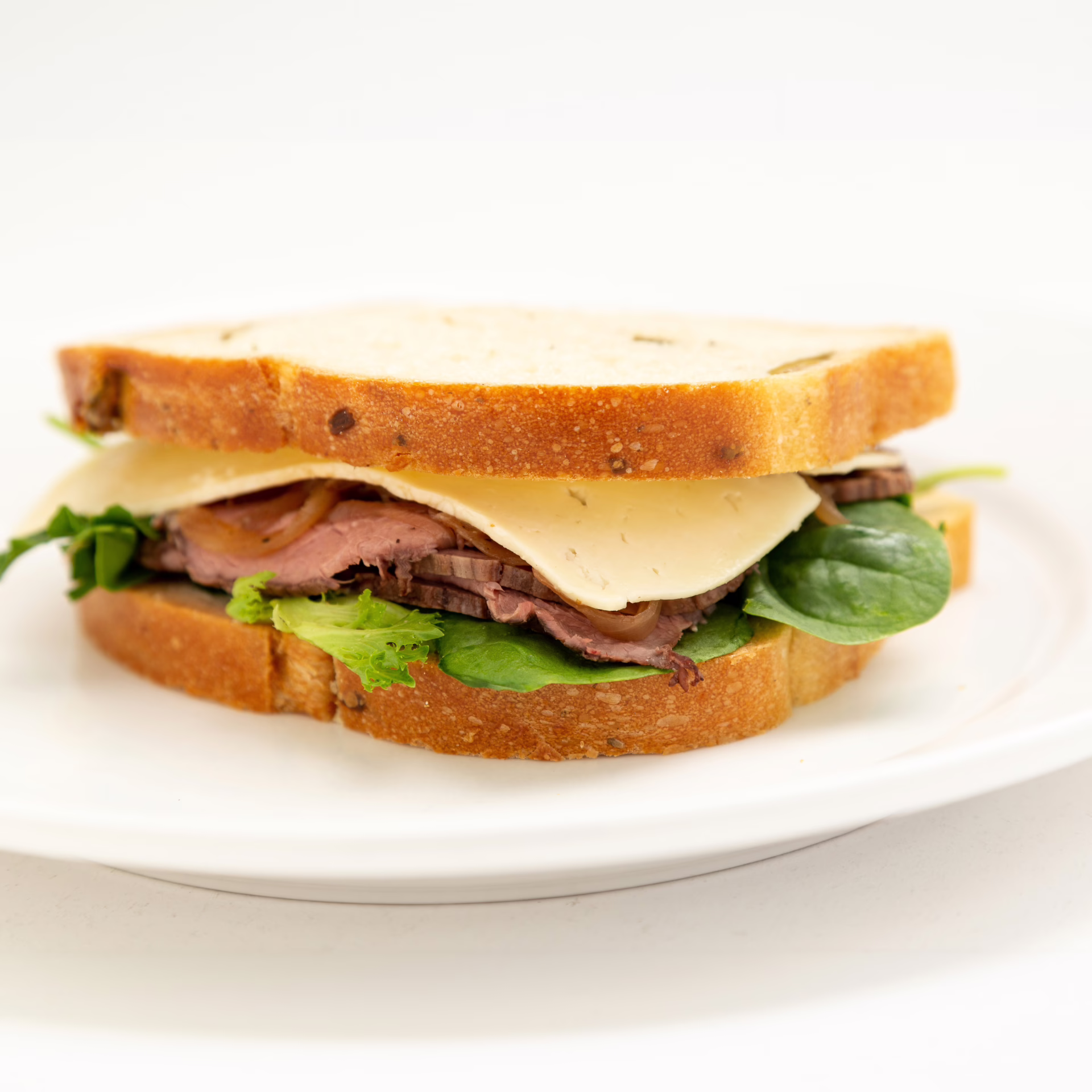 Walnut loaf, horseradish mayonnaise, roast beef, Havarti cheese, caramelized onion, and mixed spring green.