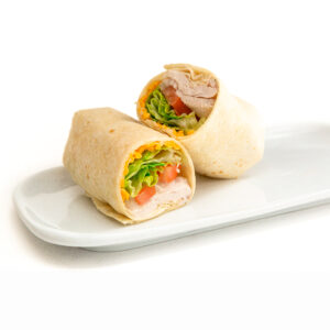 White tortilla, shredded cheddar cheese, mayonaise, chopped romaine, bacon strip, turkey breast, and tomato.