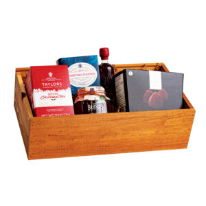 Fireside luxury holiday gift basket with premium gourmet treats and festive flavors